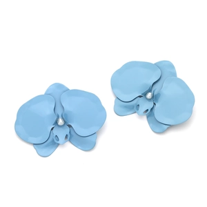 Macro view of matte blue orchid earrings with a white pearl center and petal details