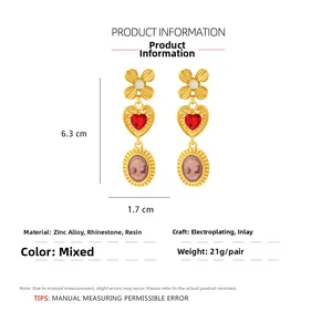 Detail view of retro palace heart drop earrings showing 6.3cm size and material info