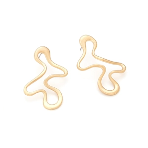 Detail of artistic wavy gold stud earrings with a hollow abstract geometric design