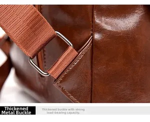 Macro detail of thick metal buckles and reinforced stitching on a vintage brown leather bag