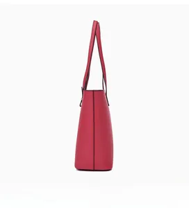 Side view of large dark red tote bag showing textured leather and detailed black edge paint