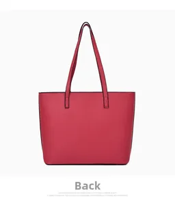 Rear view of large deep pink leather tote bag with cross-texture finish and handles