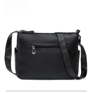 Rear view of black lychee texture leather bag featuring a functional back zipper pocket