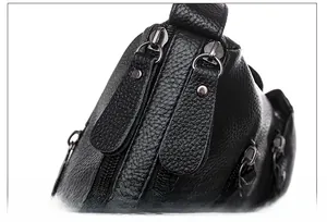 Detail of premium black lychee leather bag featuring double high-quality zippers