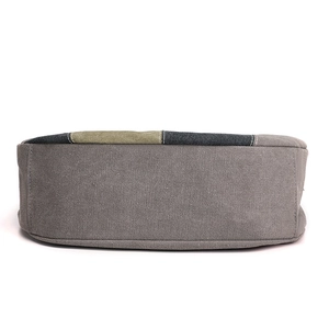 Contrast color canvas tote bag with olive green stitching and durable grey bottom panel