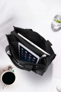 Top view of a spacious black nylon tote bag with dual compartments for A4 files and laptop