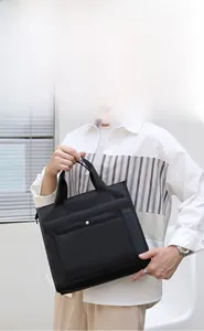 Business casual waterproof nylon tote bag with reinforced handles and front snap pocket