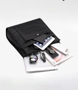 Detail view of large capacity nylon laptop bag showing compartments and storage space