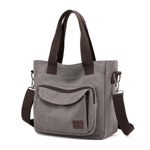 Grey large capacity canvas tote bag with brown handles and adjustable shoulder strap