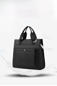 Lightweight black water-resistant nylon laptop bag detail showing 0.49kg weight feature