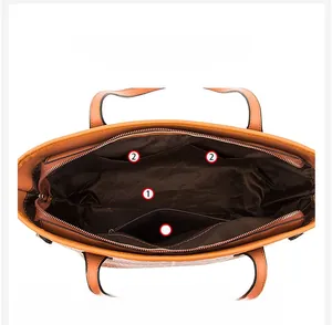 Top view of orange tote interior showing main compartment and multiple organizer pockets