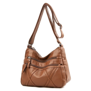 Brown faux leather crossbody bag with multiple zip pockets and diamond stitched texture