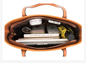 Spacious interior of a brown tote bag showing a laptop, umbrella, and daily essentials