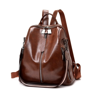 Vintage dark brown soft leather backpack for women with metallic zipper and woven straps