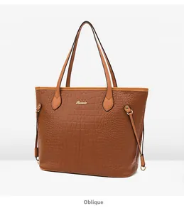 Oblique view of brown crocodile texture tote bag with Balade logo and long handles
