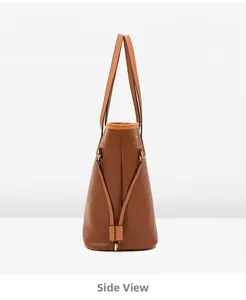 Side view of caramel brown tote bag showing crocodile texture and slim shoulder straps