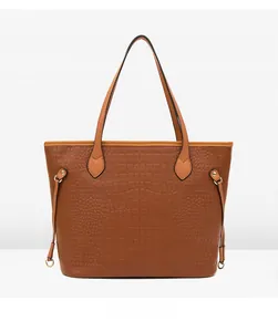Rear view of brown faux leather tote bag featuring crocodile embossed texture and dual handles
