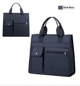 Detail of dark blue waterproof nylon briefcase with multi-compartment front pockets