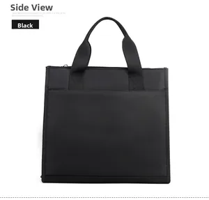 Rear view of black waterproof nylon laptop bag showing wide back pocket and sturdy handles