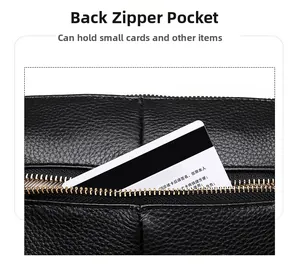 Detail of the back zipper pocket on black lychee leather bag for small cards storage