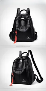 Detail view of black textured leather backpack featuring Kangaroo logo and red zipper pull