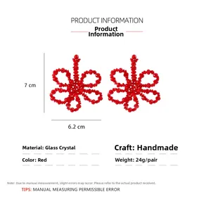 Detail view of handmade red crystal flower drop earrings with dimensions 7cm by 6.2cm