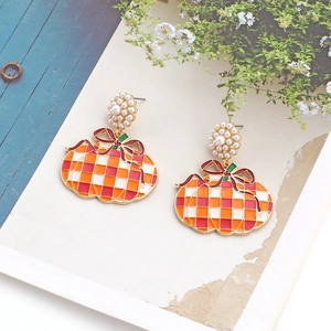 Christmas gift bag earrings with pearl flowers and colorful enamel bow charms