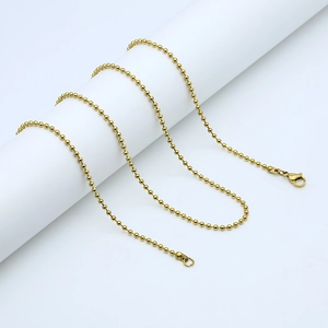 Detail of a 304 stainless steel gold bead chain necklace with lobster clasp