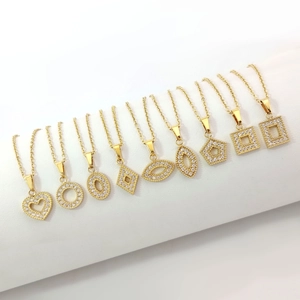 Set of ten gold titanium steel necklaces with various geometric zircon pendants