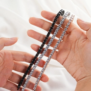 Three tennis bracelets in black, silver, and rose gold with pavé cubic zirconia