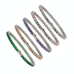 Detail of five multi-colored tennis bracelets with cubic zirconia and silver metal finish