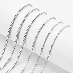 Polished stainless steel box chains in multiple widths displayed on white background