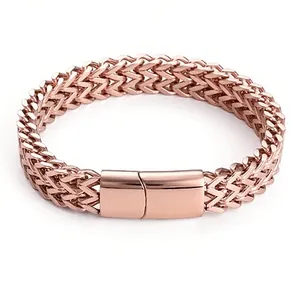 Detail of rose gold stainless steel woven wheat chain with sleek magnetic clasp closure