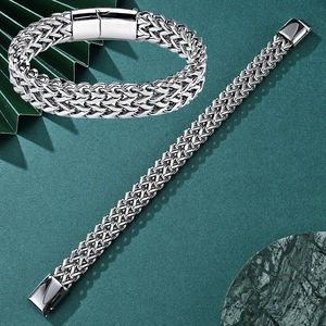 Close-up of a men's silver Franco chain bracelet with a secure rectangular clasp
