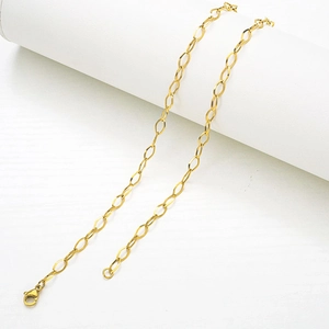 Elegant gold stainless steel oval link necklace with secure lobster clasp on white stand