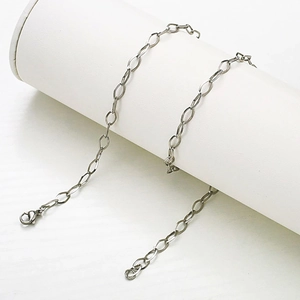 Close-up of stainless steel oval link chain with a secure lobster clasp connector
