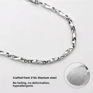 Macro detail of silver mobius twisted 316L titanium steel necklace chain