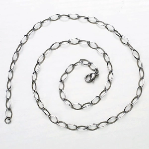 Close-up of stainless steel oval link chain with lobster clasp on white background