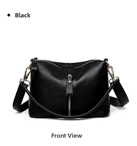 Detailed front view of black pebbled leather crossbody bag with gold hardware accents