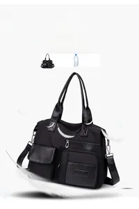 Detail shot of lightweight 520g black nylon tote bag with feathers emphasizing lightness