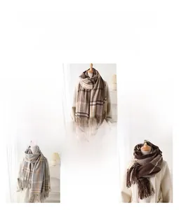Detailed view of three warm plaid scarves with fringes in various color patterns