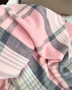 Close-up of pink and grey plaid scarf showing soft twill weave texture and thick fabric