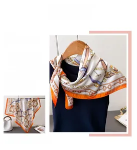 Detail of elegant equestrian print silk scarf with chain horse harness motifs