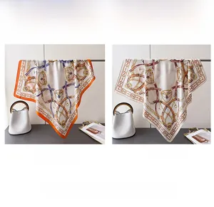 Elegant equestrian silk scarf with horse bit pattern in orange and white variants