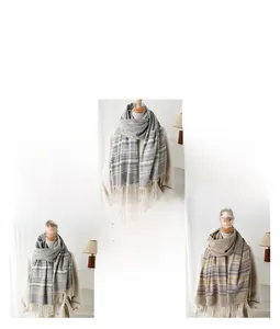 Detail of plaid and striped scarves with tassels on mannequins for winter fashion