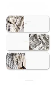 Detailed close-up showing high-quality wool rich fabric texture and plaid tassel edges
