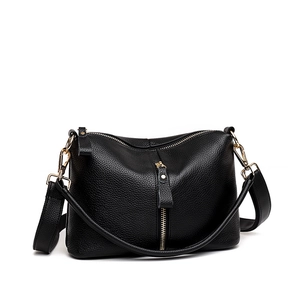 Minimalist black pebbled leather tote bag for women with golden metal zipper and hardware