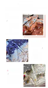 Detail view of paisley print faux silk scarf showing vibrant floral patterns and fine stitching