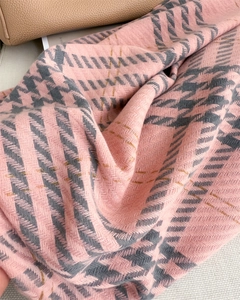 Close-up of pink and grey check scarf with gold metallic threads and soft twill weave