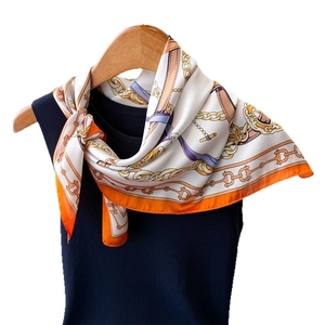 Elegant equestrian horse print silk scarf featuring classic belt patterns and vivid colors